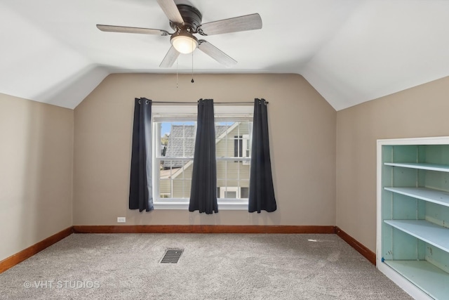 additional living space featuring carpet floors, ceiling fan, and lofted ceiling