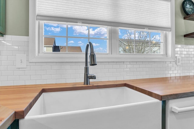 details featuring sink and wood counters