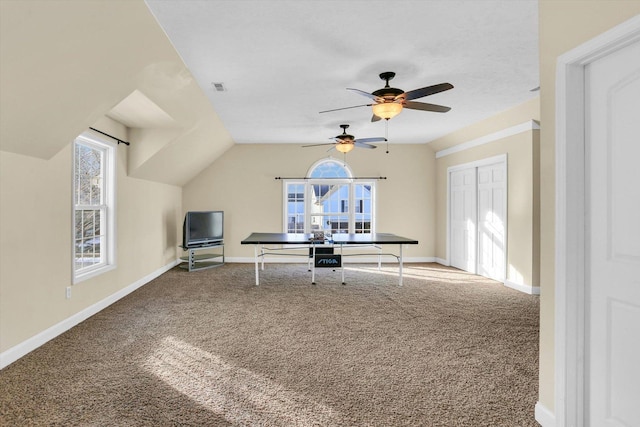 unfurnished office featuring vaulted ceiling and carpet flooring