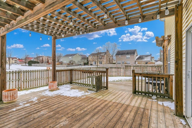 snow covered deck featuring a pergola