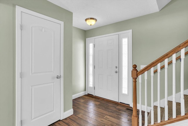 entryway with dark wood-type flooring