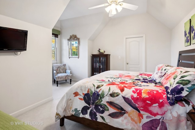 carpeted bedroom featuring ceiling fan and lofted ceiling