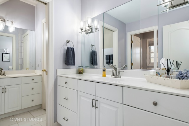 bathroom with tile patterned flooring and vanity