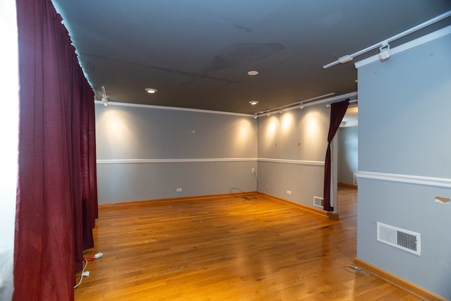 unfurnished room with hardwood / wood-style flooring