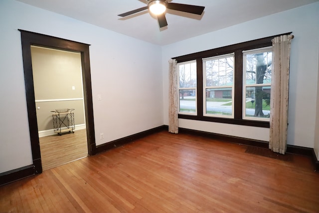 spare room featuring hardwood / wood-style flooring and ceiling fan