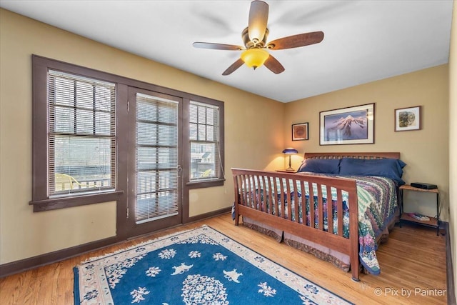 bedroom with hardwood / wood-style floors and ceiling fan