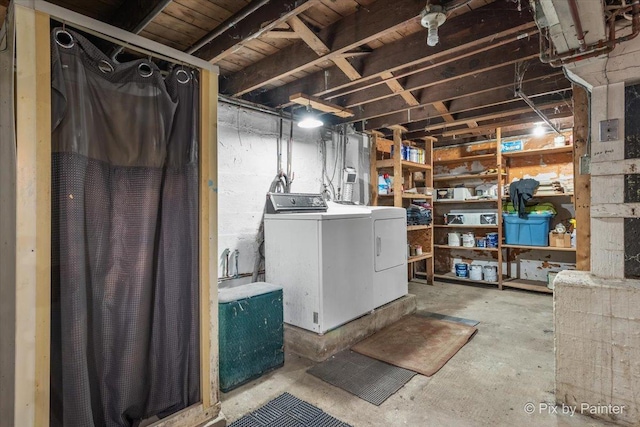 basement with washing machine and clothes dryer