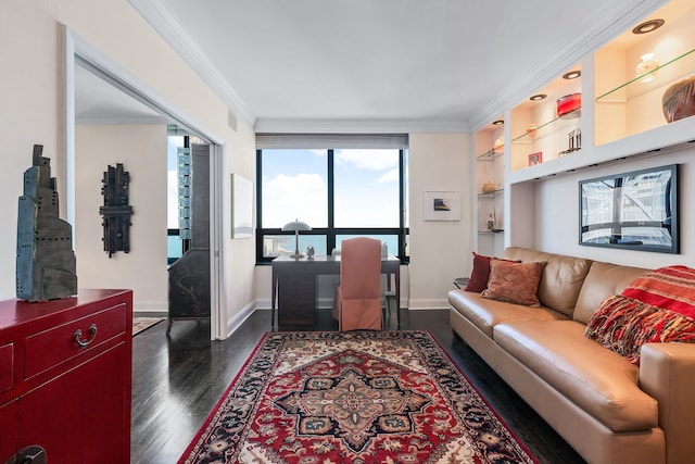 living room with ornamental molding, dark hardwood / wood-style flooring, and built in shelves