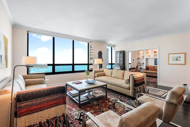 living room with a water view, crown molding, and hardwood / wood-style flooring