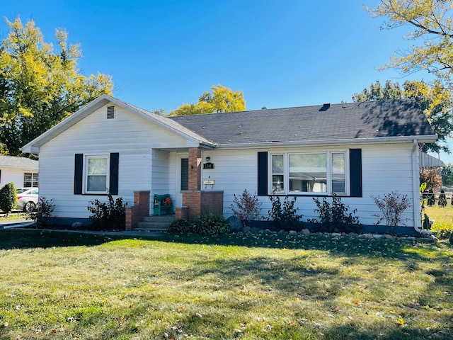 ranch-style home with a front yard