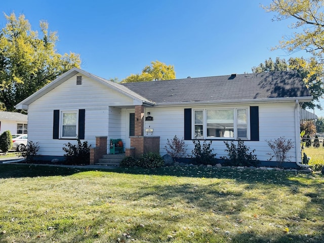 ranch-style home with a front yard