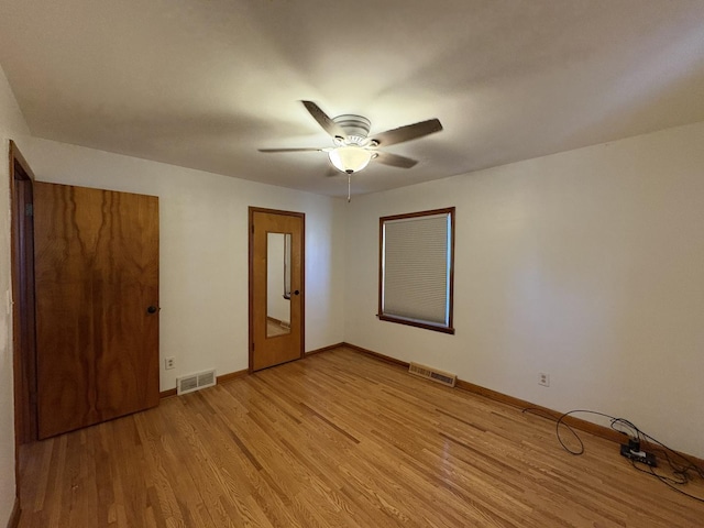 unfurnished room with ceiling fan and light hardwood / wood-style flooring