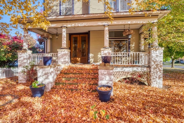 view of exterior entry featuring a porch