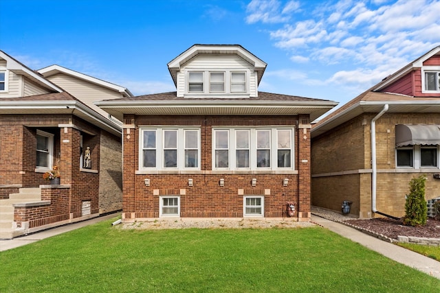 rear view of property with a yard