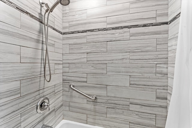 bathroom with shower / tub combo with curtain