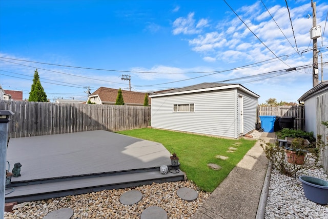 view of yard with a storage shed and a deck