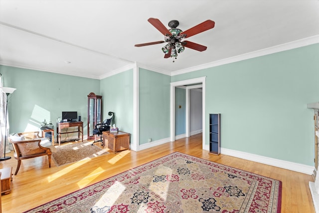 interior space featuring ornamental molding, wood-type flooring, and ceiling fan