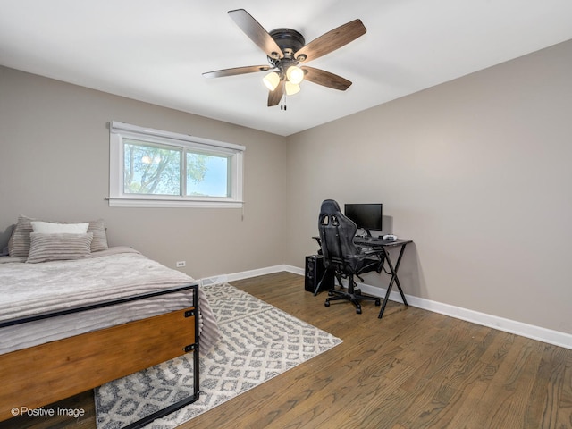 bedroom with ceiling fan and dark hardwood / wood-style floors