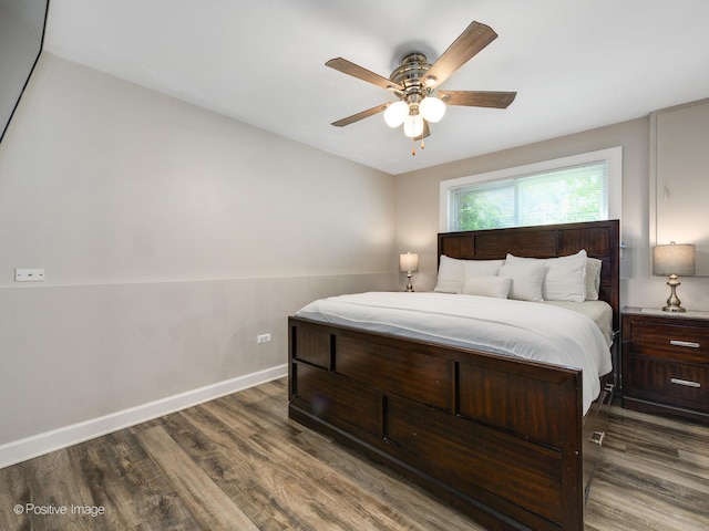 bedroom featuring dark wood-type flooring and ceiling fan