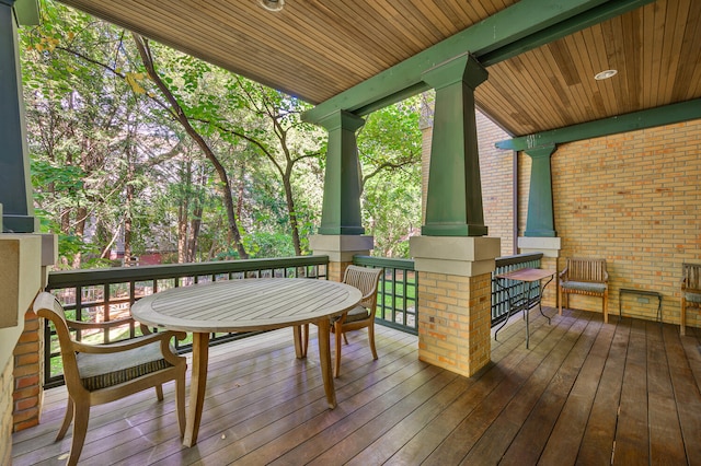 wooden terrace featuring covered porch