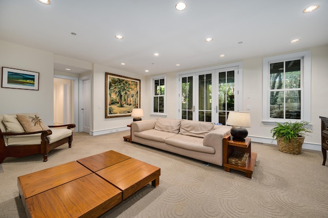 carpeted living room with a baseboard radiator