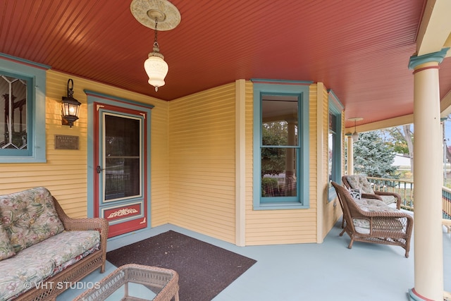 view of exterior entry featuring a porch