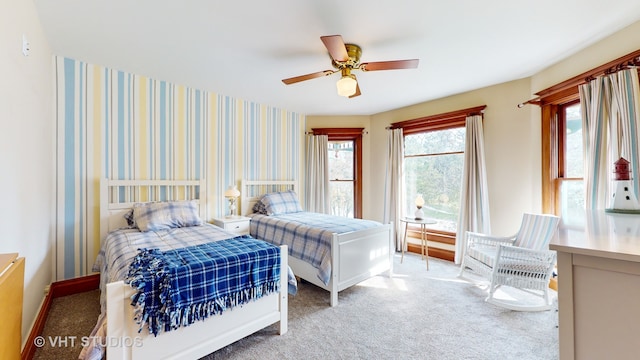 bedroom with ceiling fan and carpet flooring