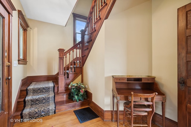 staircase featuring hardwood / wood-style floors