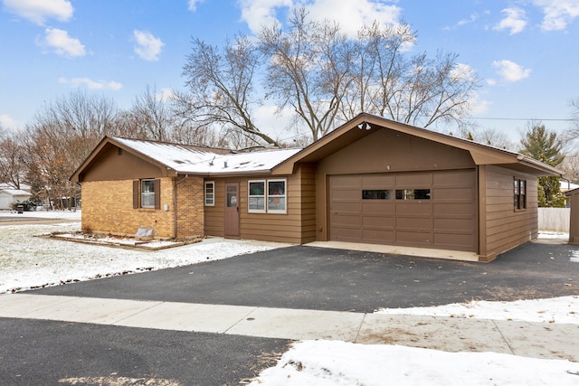 ranch-style house featuring a garage