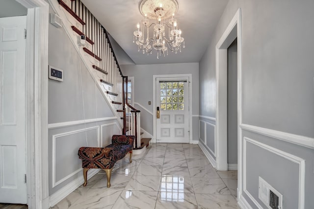 entrance foyer with an inviting chandelier