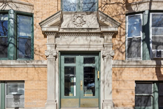 entrance to property with french doors and brick siding