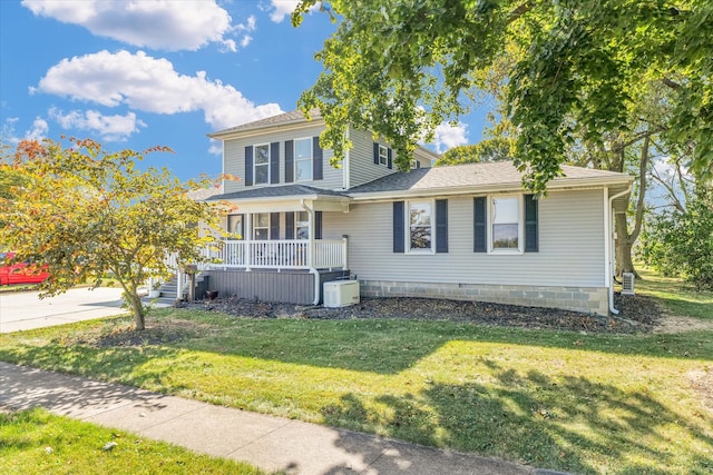 view of front of home with a front yard and a porch