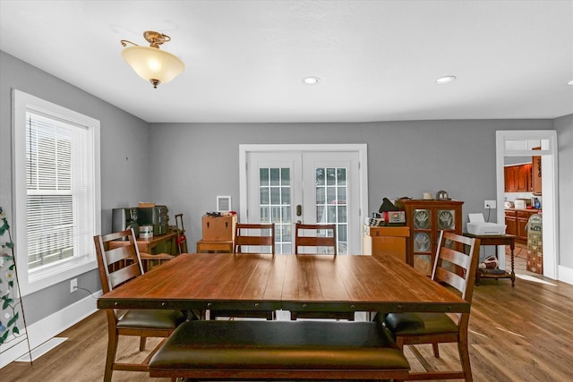 dining area featuring hardwood / wood-style floors and french doors