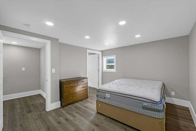 bedroom with hardwood / wood-style flooring