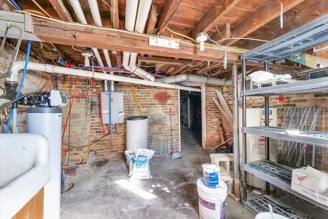 basement featuring brick wall and gas water heater