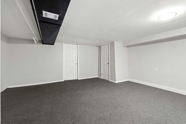 basement with dark colored carpet