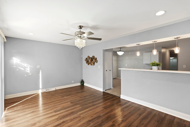 unfurnished room with wood-type flooring and ceiling fan