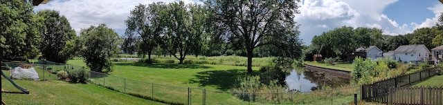 view of home's community with a yard