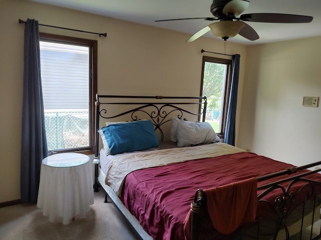 bedroom with ceiling fan and carpet flooring