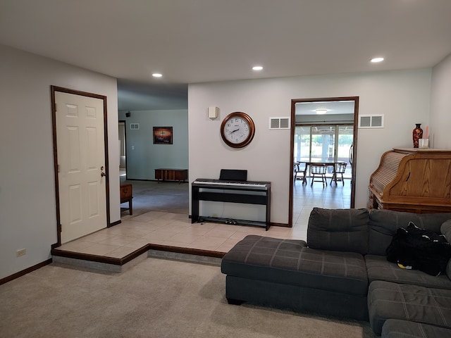 living room featuring light carpet