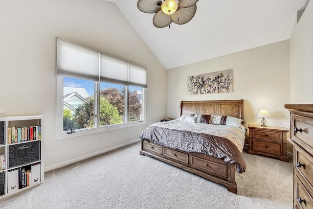 carpeted bedroom featuring lofted ceiling and ceiling fan