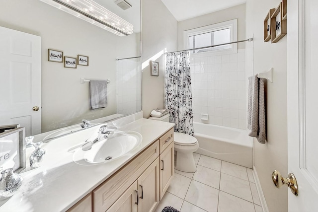 full bathroom featuring vanity, shower / tub combo with curtain, toilet, and tile patterned floors