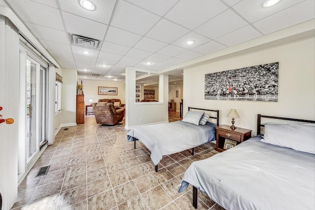 bedroom featuring a drop ceiling