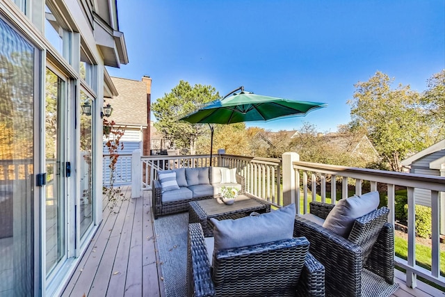 wooden deck featuring outdoor lounge area