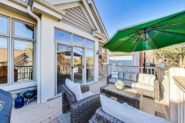 wooden deck featuring an outdoor hangout area