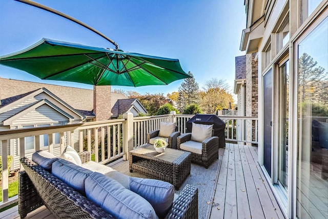 wooden terrace featuring outdoor lounge area