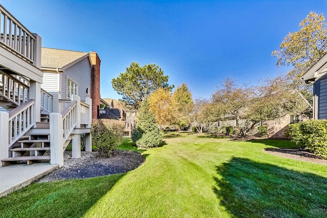 view of yard with a wooden deck