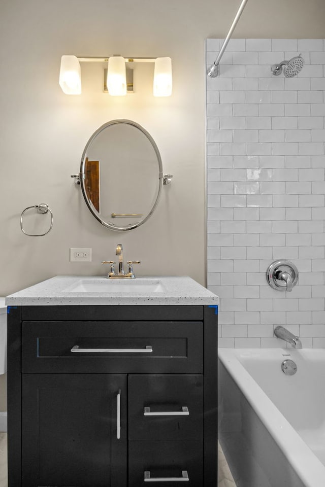 bathroom featuring vanity and washtub / shower combination