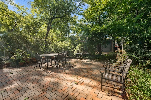 view of patio featuring outdoor dining area