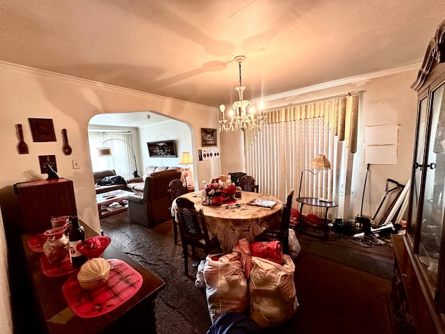 carpeted dining room featuring crown molding and an inviting chandelier